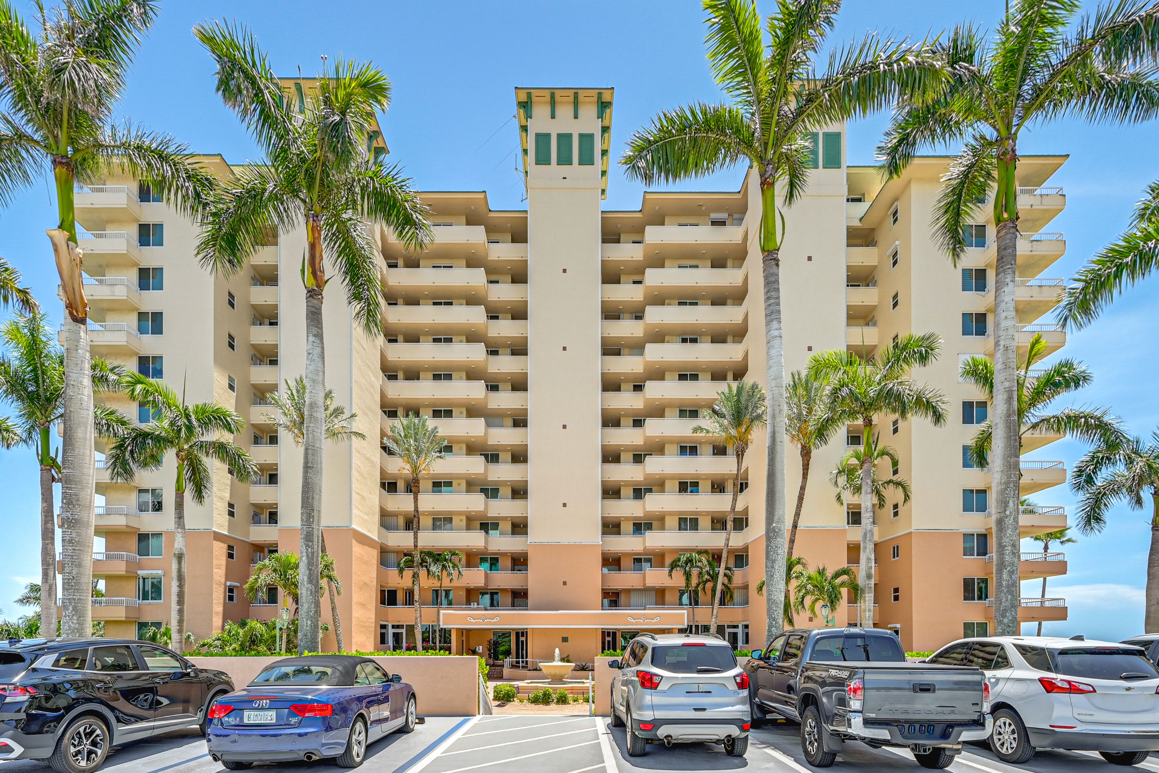 Condo Exterior | Assigned Garage Space (1 Vehicle) | Community Surface Lot
