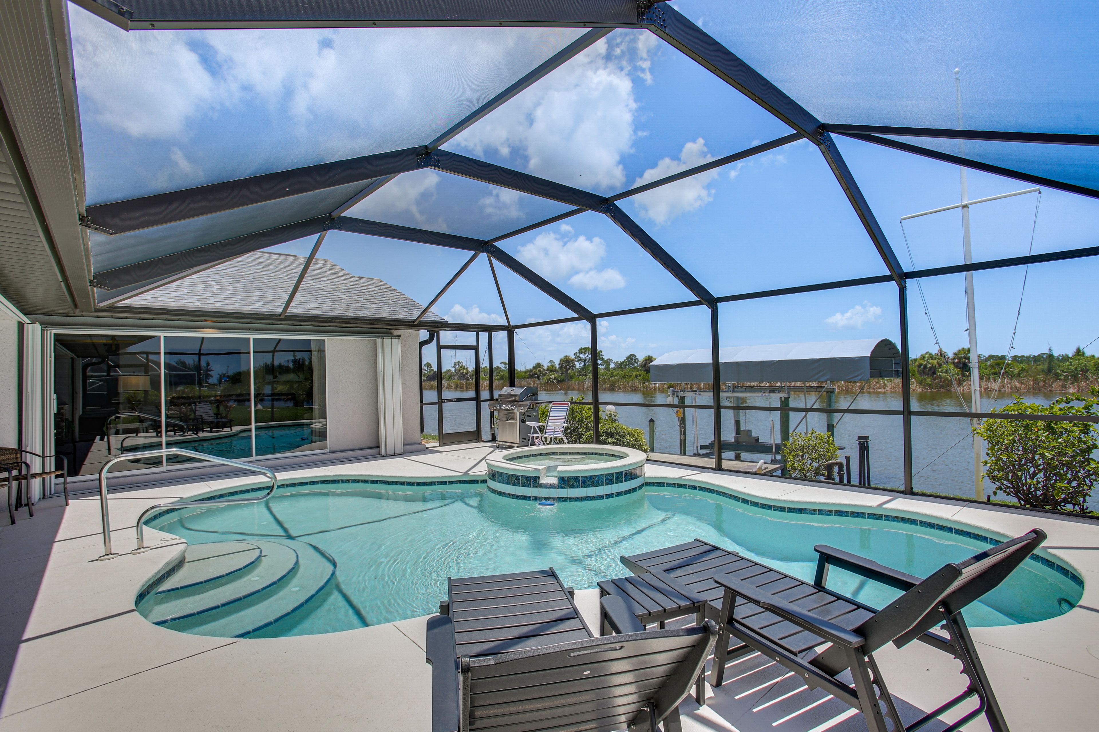 Port Charlotte Vacation Rental | 3BR | 3BA | 2,280 Sq Ft | 1 Step to Access