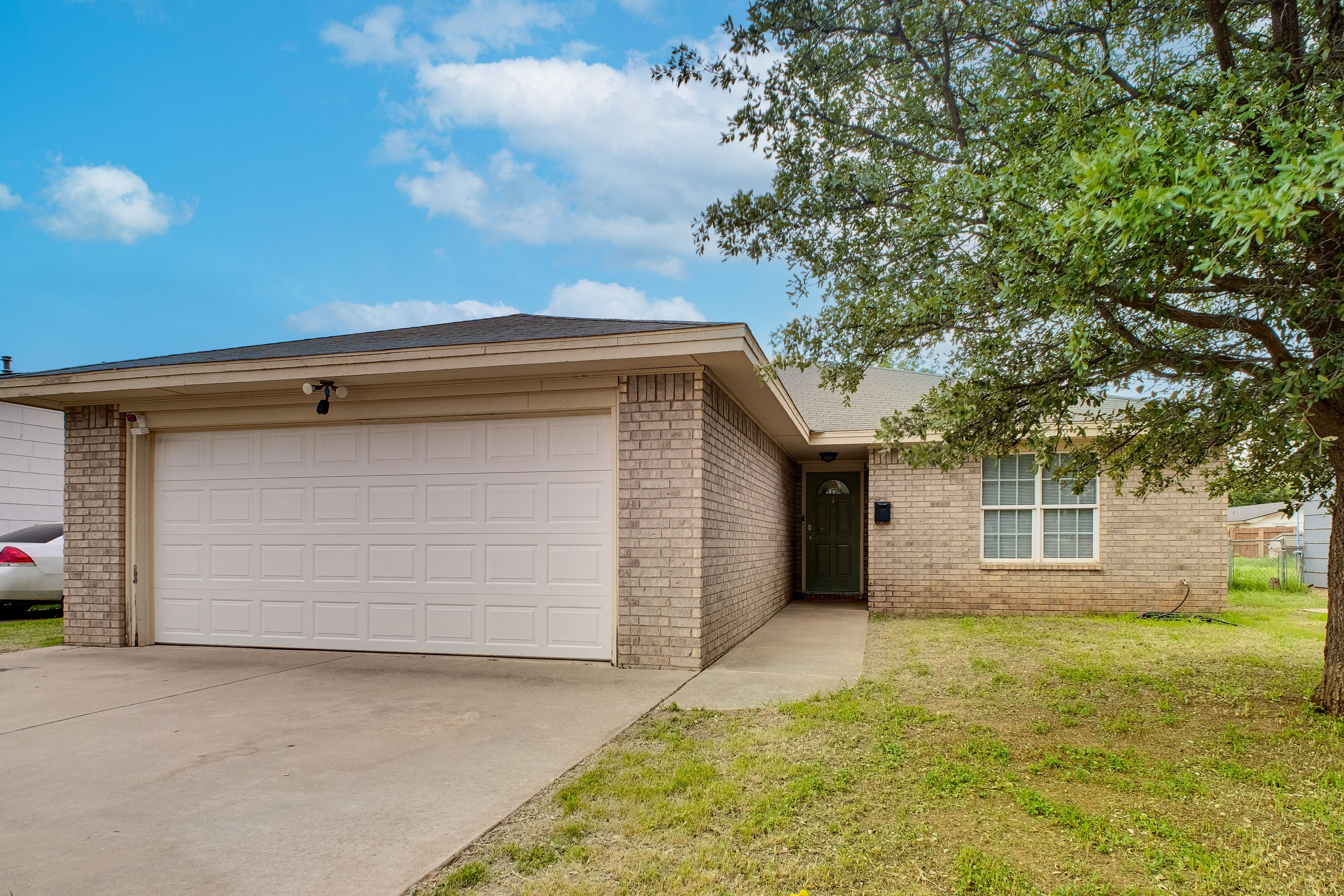 Property Exterior | Covered Patio | Fenced-In Yard