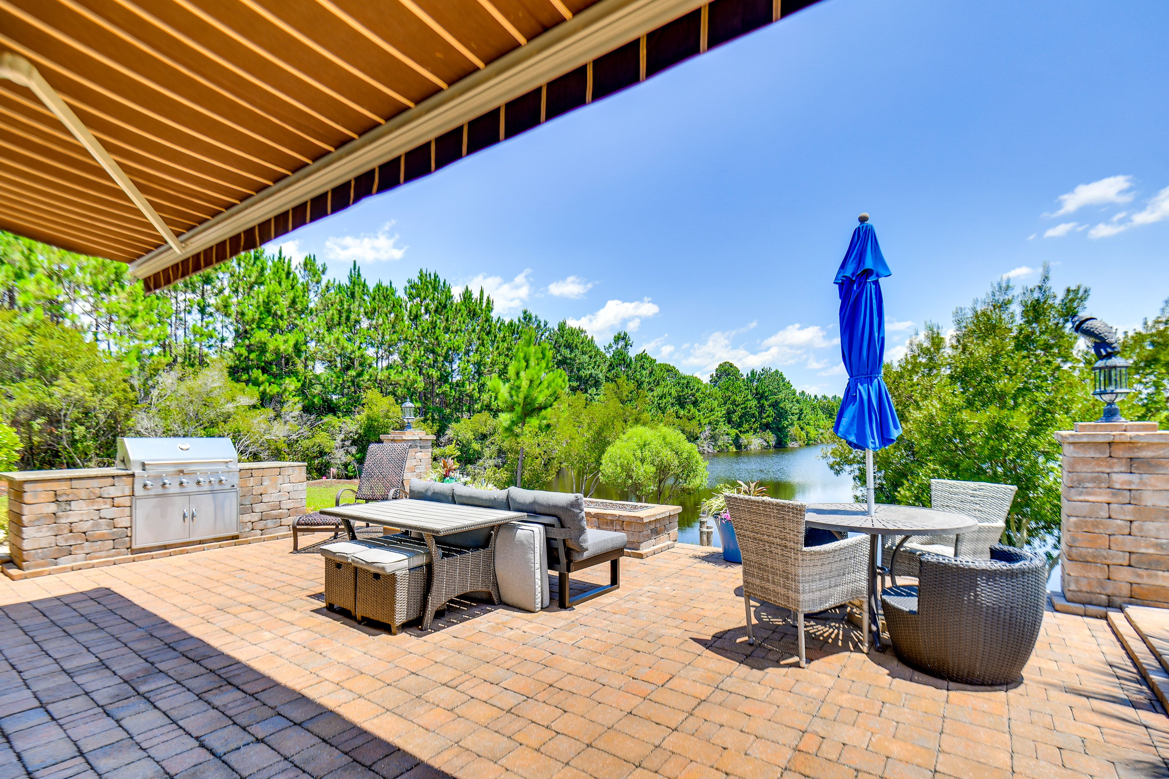 Spacious Patio | Outdoor Dining & Lounge Areas | Pond Views