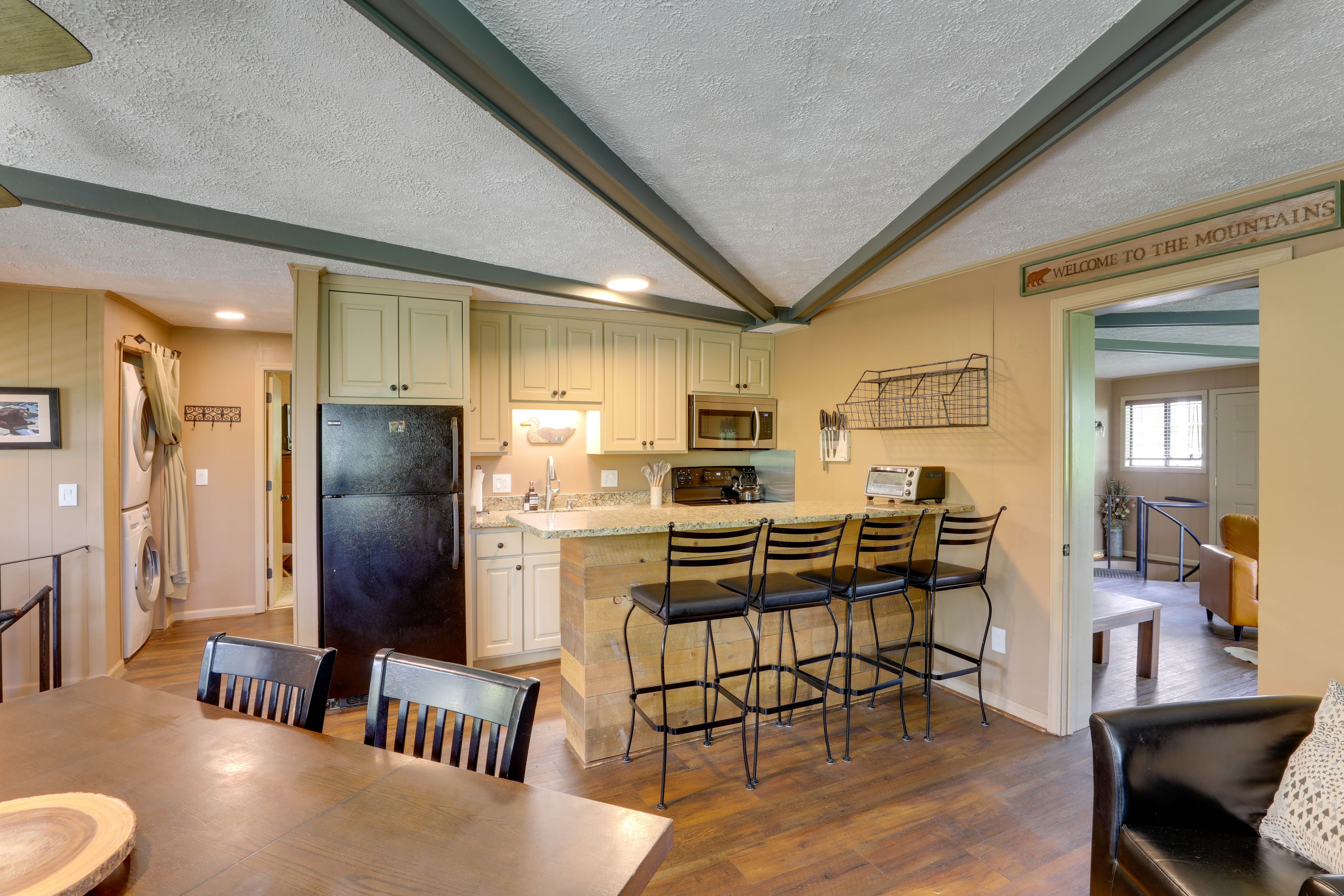 Kitchen & Dining Area | Unique Layout w/ 2 Spiral Staircases