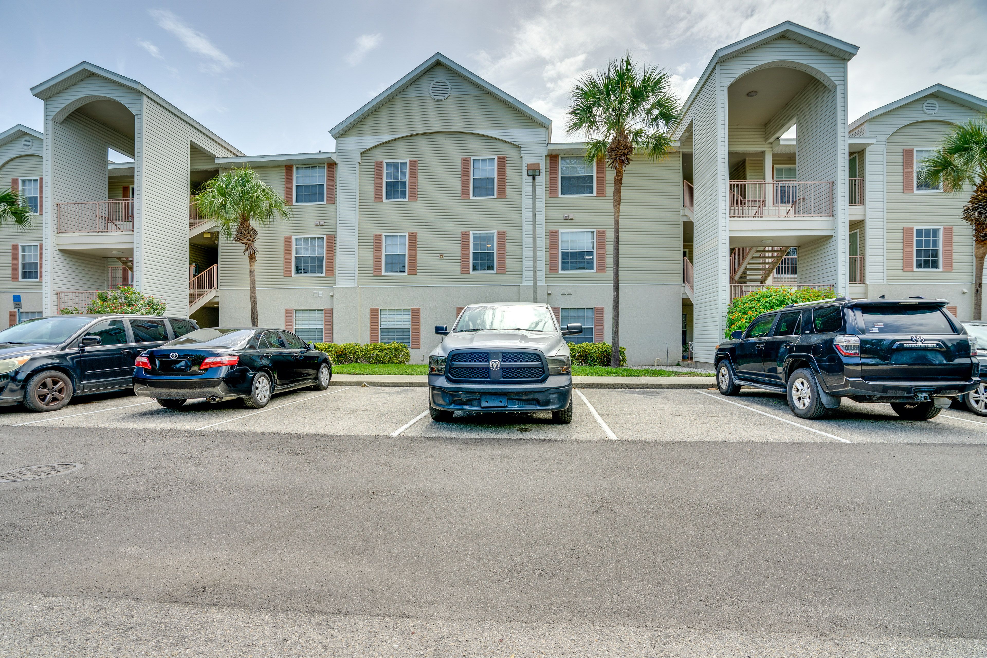 Condo Exterior | Open Lot (1 Vehicle, Pass Provided) | Overflow Parking Lot