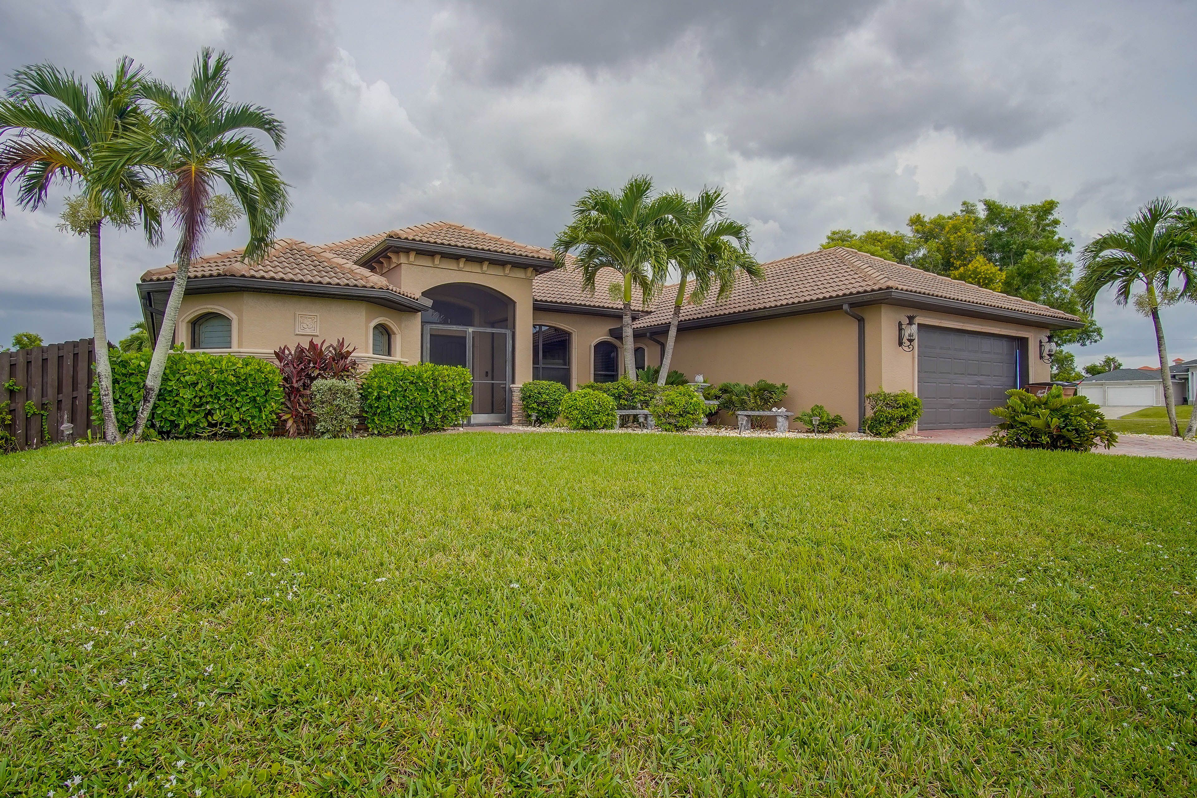 Property Exterior | Screened-In Lanai w/ Private Pool | Outdoor Shower