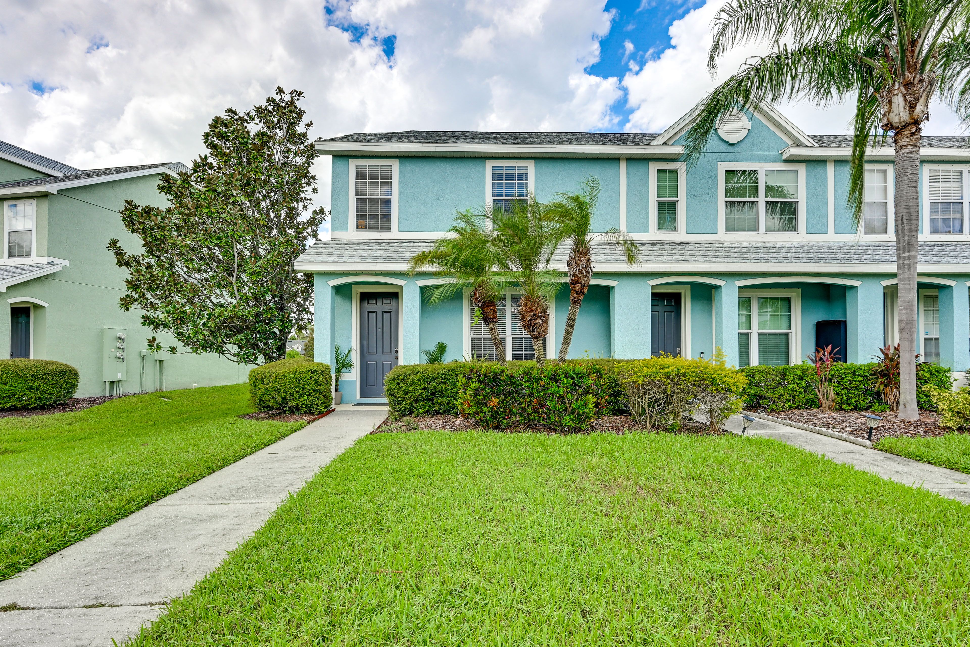 Townhome Exterior | Dedicated Parking (1 Vehicle) | Open Lot