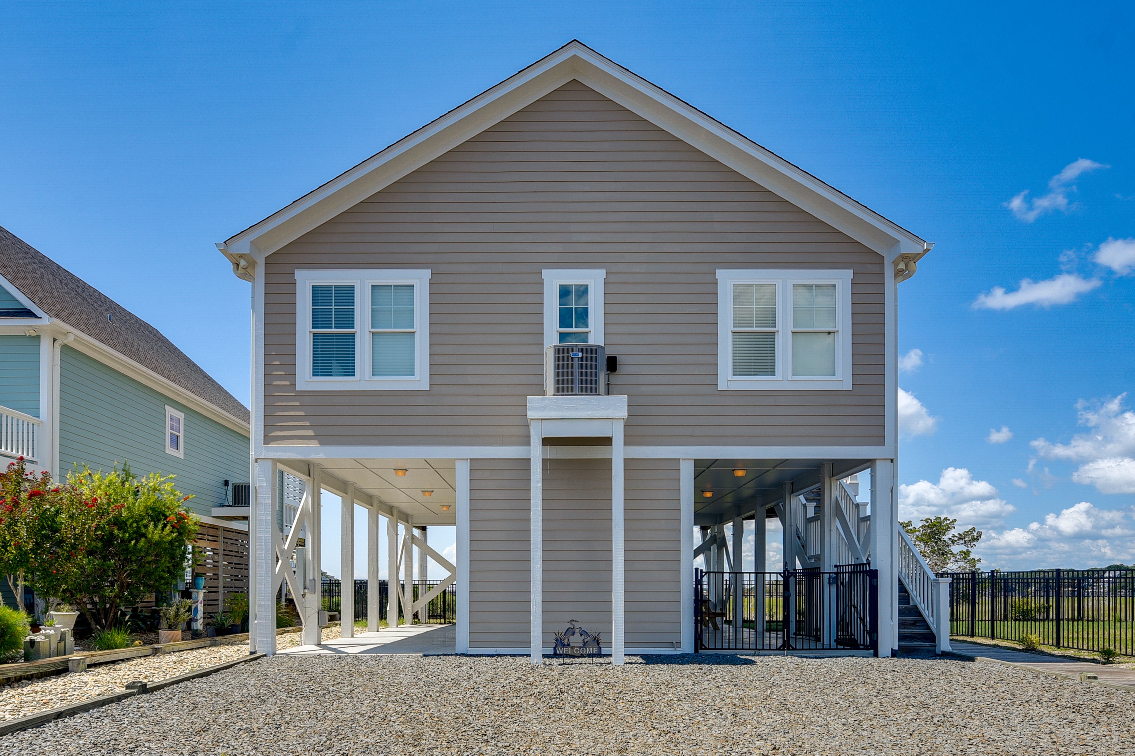 Carport (1 Compact Vehicle) | Gravel Driveway (2 Vehicles)