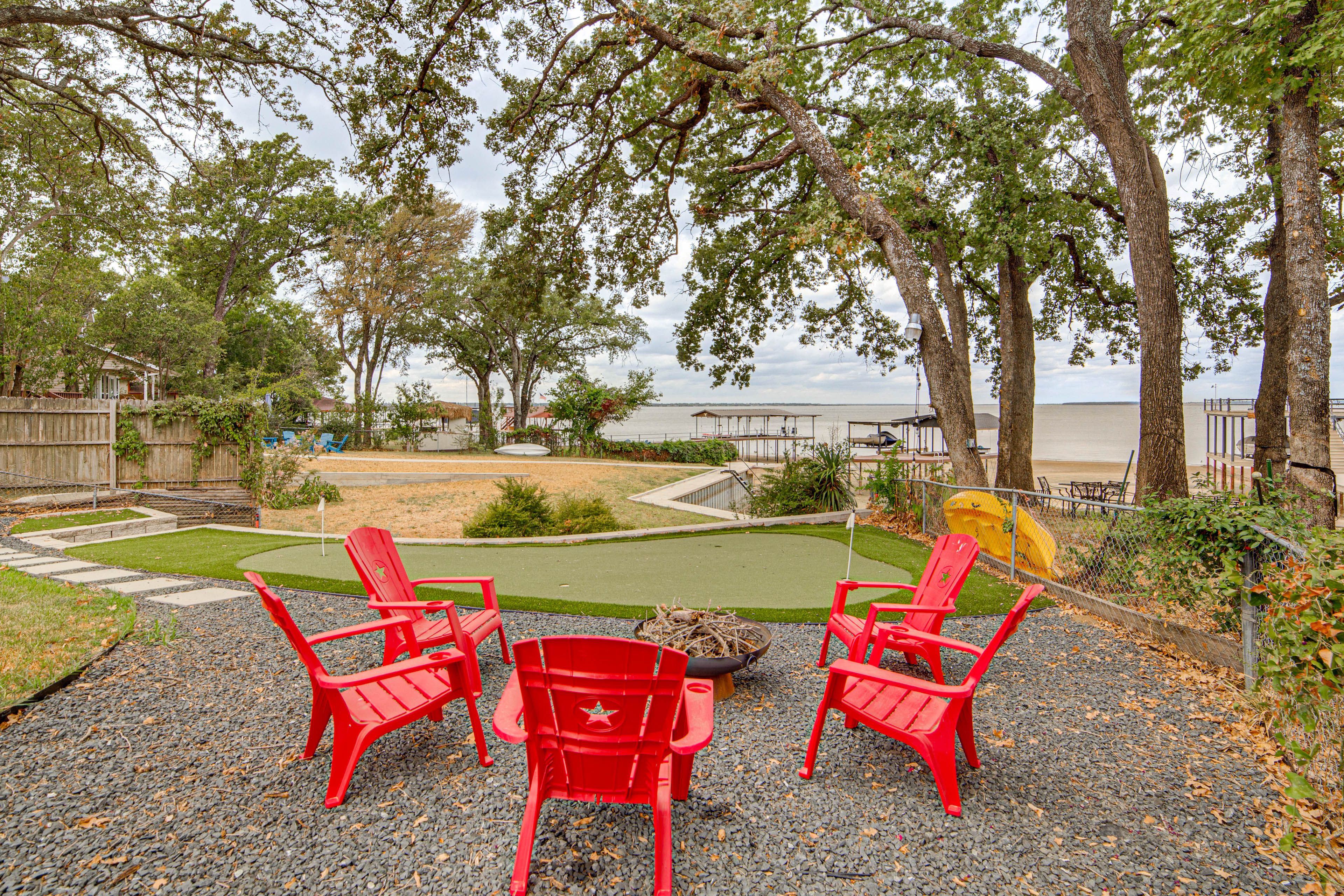 Exterior | Fire Pit w/ Seating | Private Putting Green | Lake Access