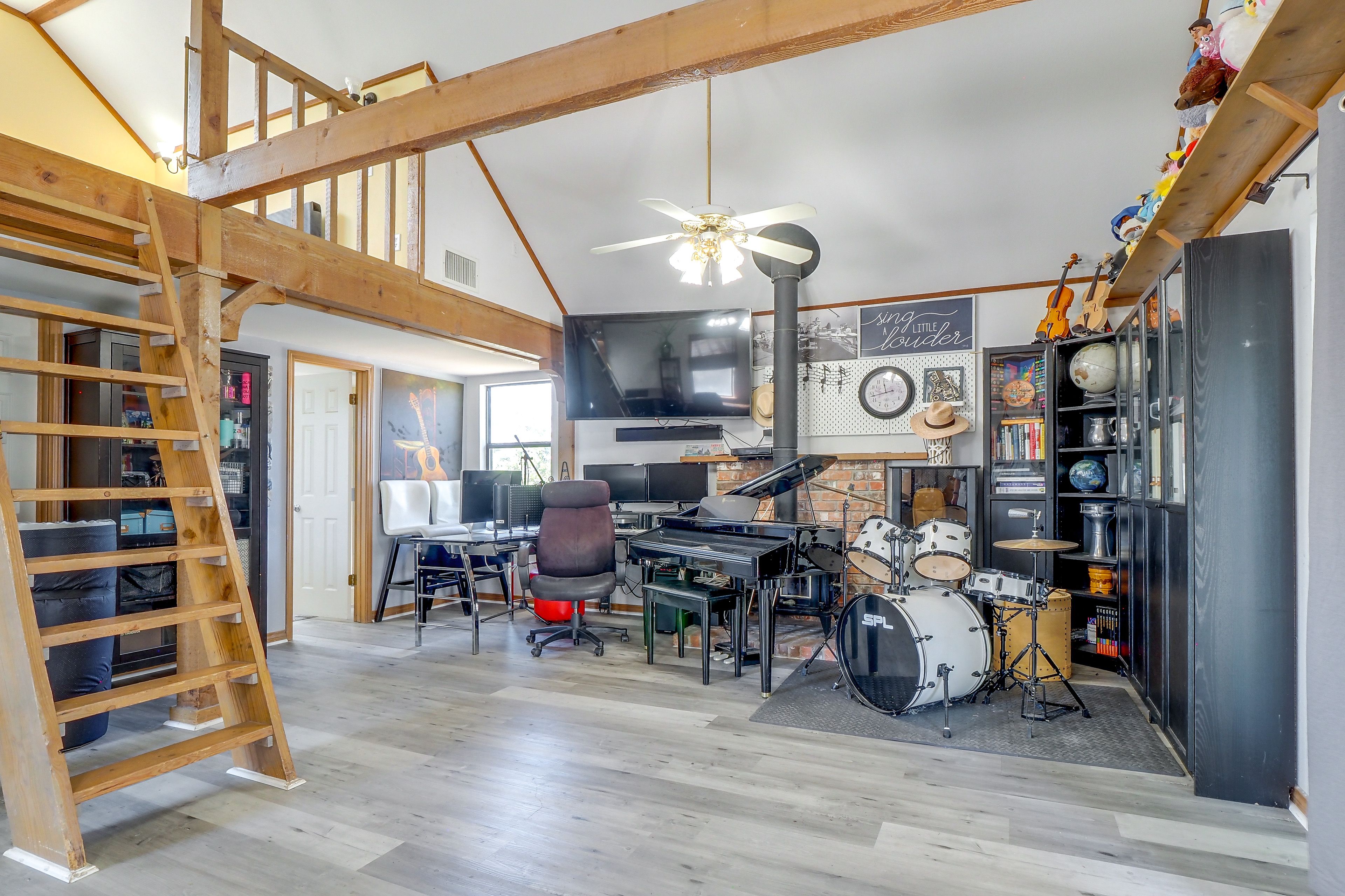 Living Area | Smart TV | Piano | Drum Set | Workspaces | Main Level